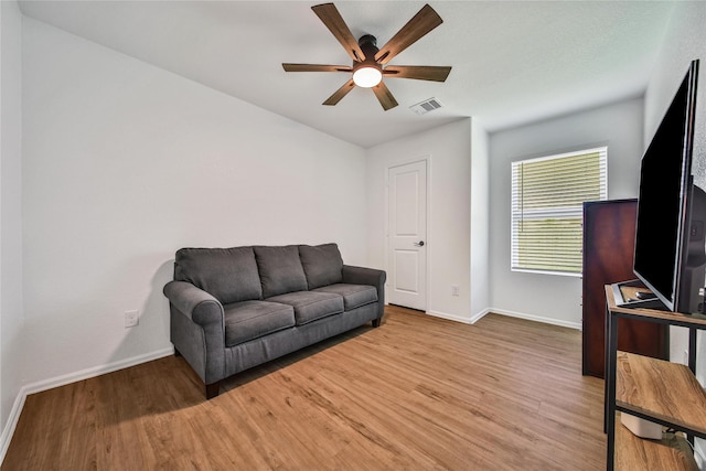 5003 Stratton Ln, Rosharon, TX 77583 - living room featuring baseboards, a ceiling fan, and wood finished floors