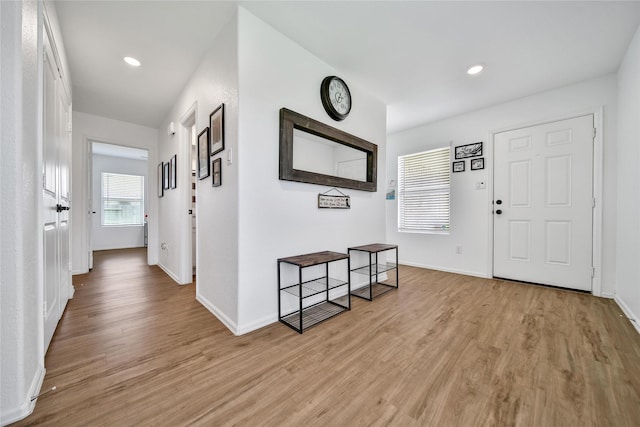 5003 Stratton Ln, Rosharon, TX 77583 - entryway with light wood-style flooring, baseboards, and recessed lighting