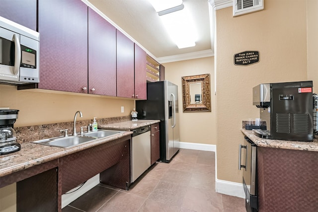 1711 Old Spanish Trl Unit 330, Houston, TX 77054 - kitchen featuring appliances with stainless steel finishes, a sink, ornamental molding, light countertops, and light tile patterned floors