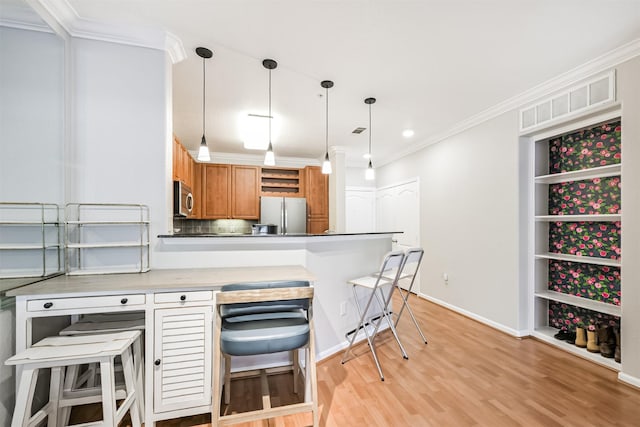 1711 Old Spanish Trl Unit 330, Houston, TX 77054 - kitchen with appliances with stainless steel finishes, brown cabinets, crown molding, open shelves, and light wood finished floors