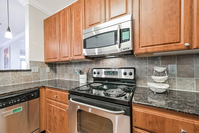 1711 Old Spanish Trl Unit 330, Houston, TX 77054 - kitchen with appliances with stainless steel finishes, crown molding, tasteful backsplash, brown cabinetry, and dark stone counters