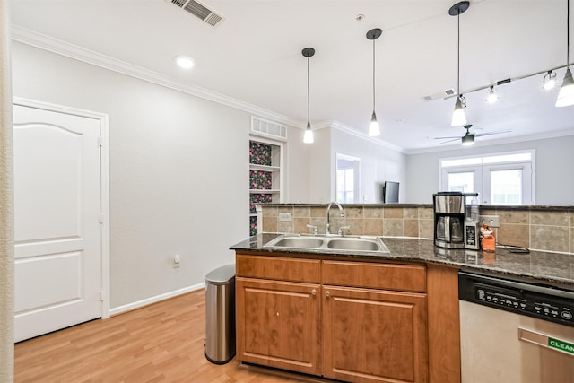 1711 Old Spanish Trl Unit 330, Houston, TX 77054 - kitchen featuring a sink, dishwasher, tasteful backsplash, ceiling fan, and brown cabinets