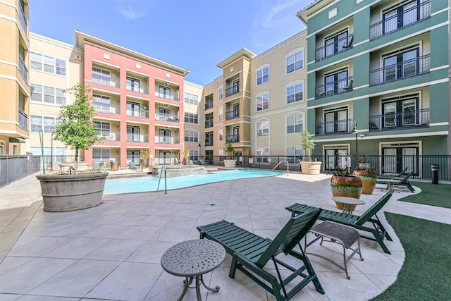 1711 Old Spanish Trl Unit 330, Houston, TX 77054 - view of swimming pool with a pool with connected hot tub, french doors, and a patio area