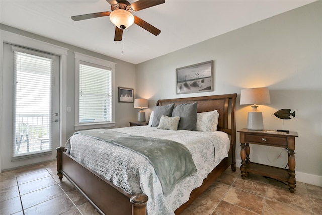27020 Estuary Dr Unit 302, Galveston, TX 77554 - bedroom featuring multiple windows, access to outside, baseboards, and a ceiling fan