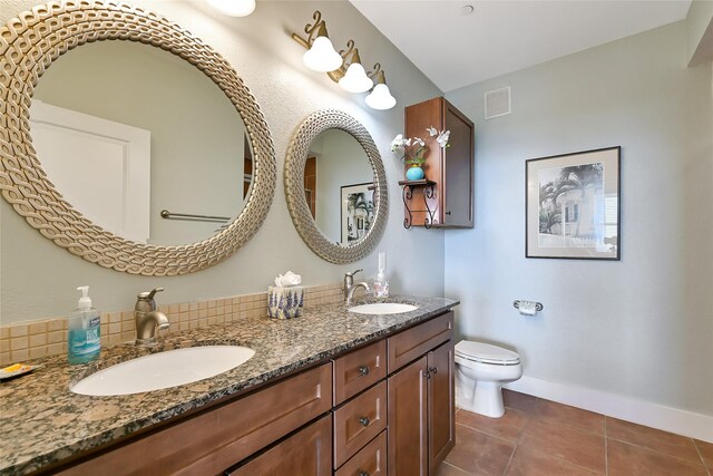27020 Estuary Dr Unit 302, Galveston, TX 77554 - full bathroom with double vanity, tile patterned floors, toilet, and baseboards