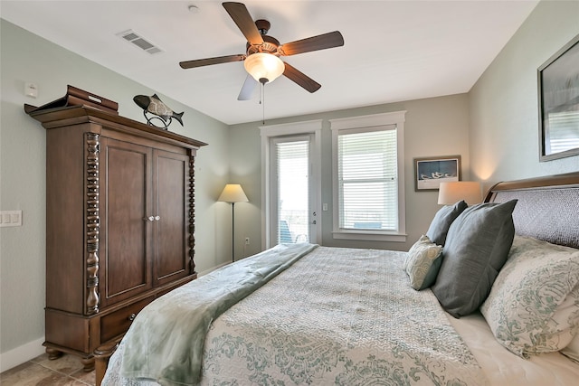 27020 Estuary Dr Unit 302, Galveston, TX 77554 - bedroom with access to outside, ceiling fan, baseboards, and light tile patterned floors