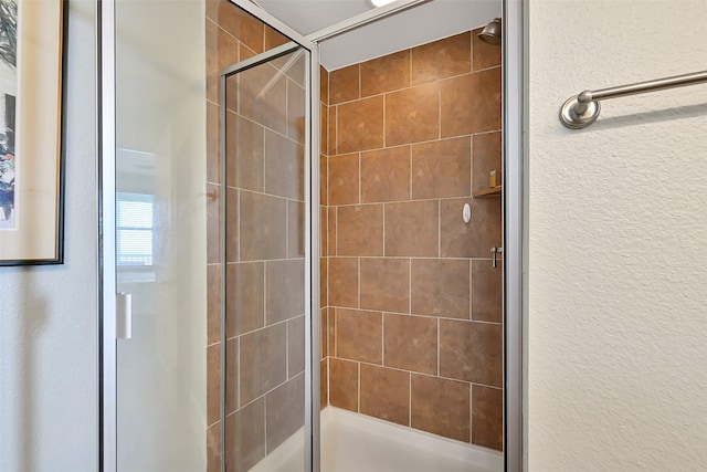 27020 Estuary Dr Unit 302, Galveston, TX 77554 - bathroom with a stall shower and a textured wall