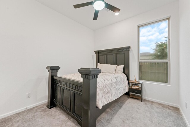 5160 Andorra Bend Ln, Porter, TX 77365 - bedroom featuring light carpet, baseboards, and a ceiling fan