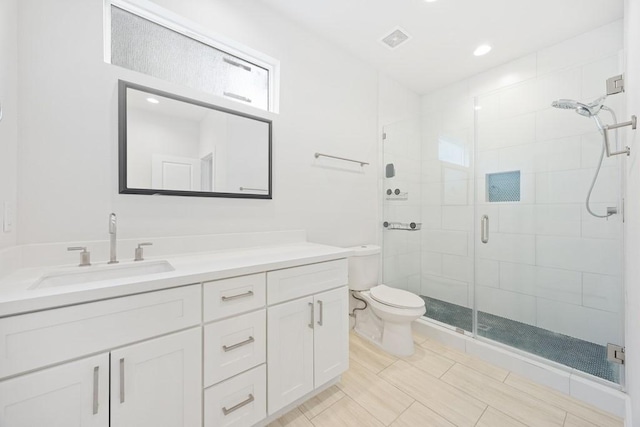 3809 Edison St, Houston, TX 77009 - bathroom with toilet, a shower stall, vanity, and recessed lighting