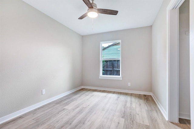 5858 Beldart St, Houston, TX 77033 - spare room featuring light wood-type flooring, ceiling fan, and baseboards