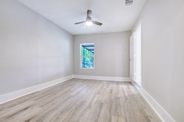 5858 Beldart St, Houston, TX 77033 - unfurnished room featuring light wood-style flooring, ceiling fan, and baseboards