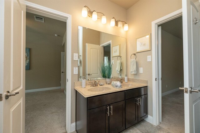 27619 Dalton Bluff Ct, Katy, TX 77494 - full bathroom featuring double vanity and baseboards