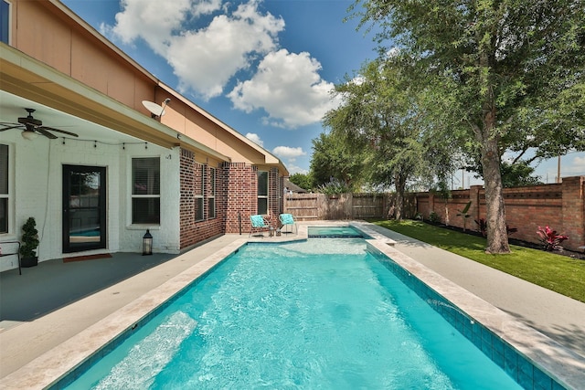 27619 Dalton Bluff Ct, Katy, TX 77494 - view of swimming pool featuring a fenced backyard, a patio, a ceiling fan, and a pool with connected hot tub