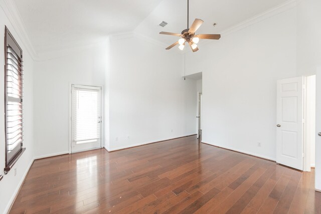 3604 Dogwood Blossom Ct, Pearland, TX 77581 - spare room with ceiling fan, ornamental molding, high vaulted ceiling, dark wood-style flooring, and baseboards