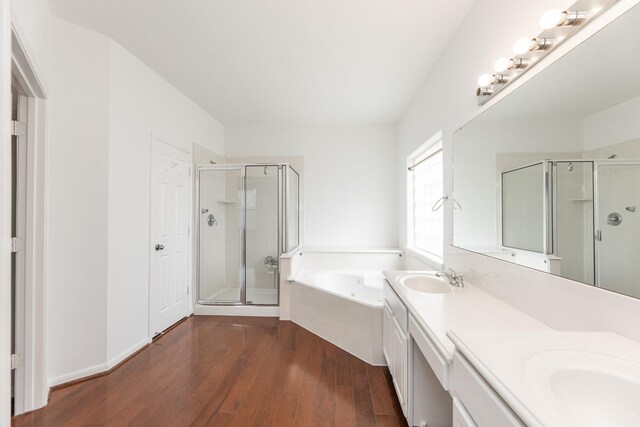3604 Dogwood Blossom Ct, Pearland, TX 77581 - full bath featuring a shower stall, hardwood / wood-style flooring, a garden tub, and double vanity