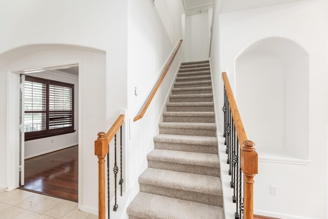 3604 Dogwood Blossom Ct, Pearland, TX 77581 - stairs featuring arched walkways
