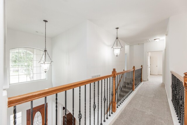 3604 Dogwood Blossom Ct, Pearland, TX 77581 - corridor with carpet, an upstairs landing, and attic access