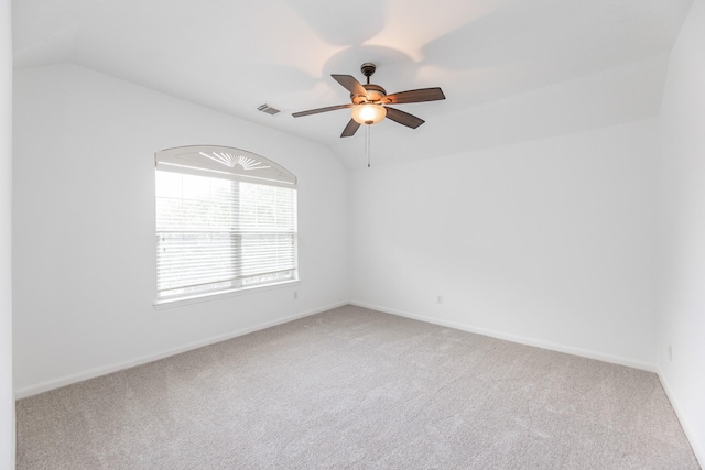 3604 Dogwood Blossom Ct, Pearland, TX 77581 - empty room featuring light carpet, lofted ceiling, a ceiling fan, and baseboards