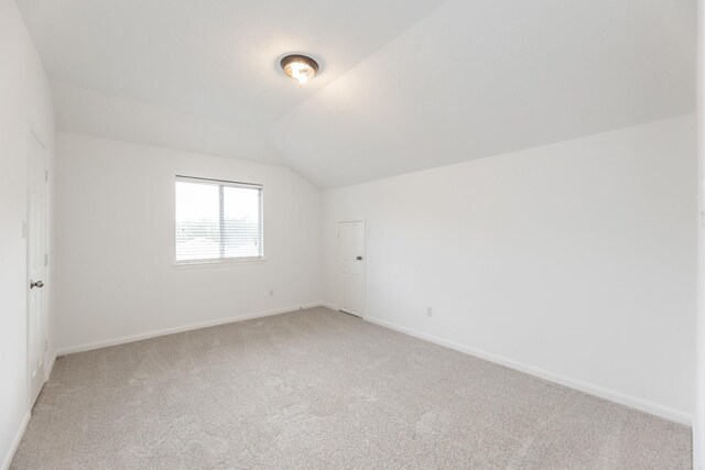 3604 Dogwood Blossom Ct, Pearland, TX 77581 - bonus room with light colored carpet, baseboards, and vaulted ceiling