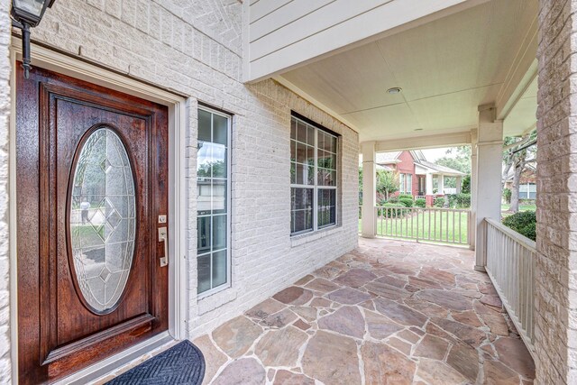3604 Dogwood Blossom Ct, Pearland, TX 77581 - entrance to property featuring a porch and brick siding