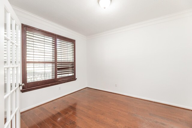 3604 Dogwood Blossom Ct, Pearland, TX 77581 - empty room with crown molding, wood finished floors, and baseboards