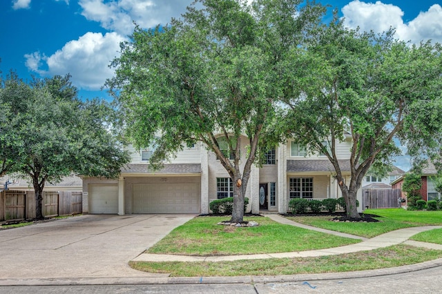 3604 Dogwood Blossom Ct, Pearland, TX 77581 - obstructed view of property with concrete driveway, an attached garage, and brick siding