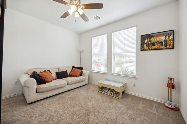8018 Royal Palm Dr, Fulshear, TX 77441 - living room with carpet flooring, ceiling fan, and baseboards