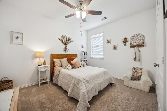 8018 Royal Palm Dr, Fulshear, TX 77441 - carpeted bedroom with ceiling fan and baseboards