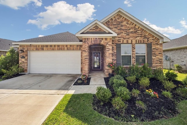 8018 Royal Palm Dr, Fulshear, TX 77441 - view of front of house with brick siding, a garage, and concrete driveway