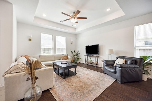 8018 Royal Palm Dr, Fulshear, TX 77441 - living area featuring a tray ceiling, a ceiling fan, recessed lighting, and dark wood finished floors