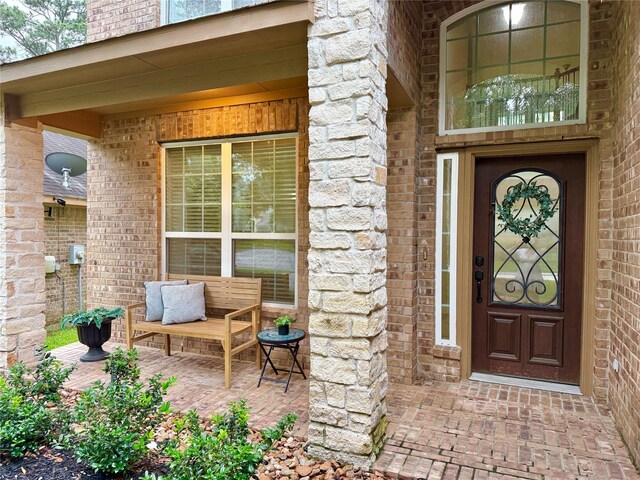 210 Black Swan Pl, The Woodlands, TX 77354 - view of exterior entry featuring brick siding