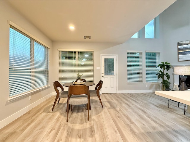 210 Black Swan Pl, The Woodlands, TX 77354 - dining area featuring baseboards and light wood finished floors