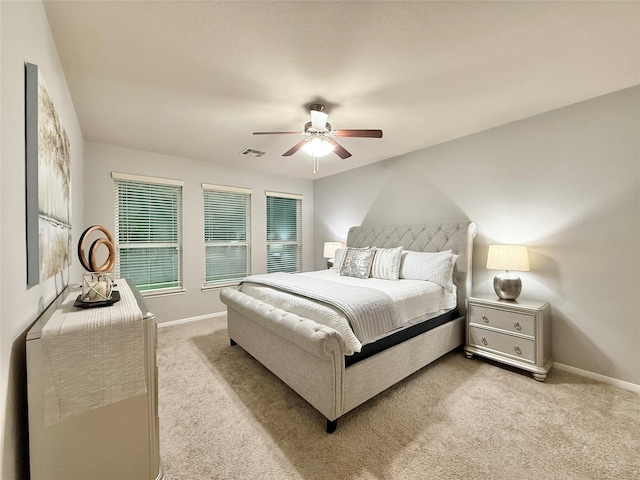210 Black Swan Pl, The Woodlands, TX 77354 - bedroom featuring light colored carpet, baseboards, and a ceiling fan