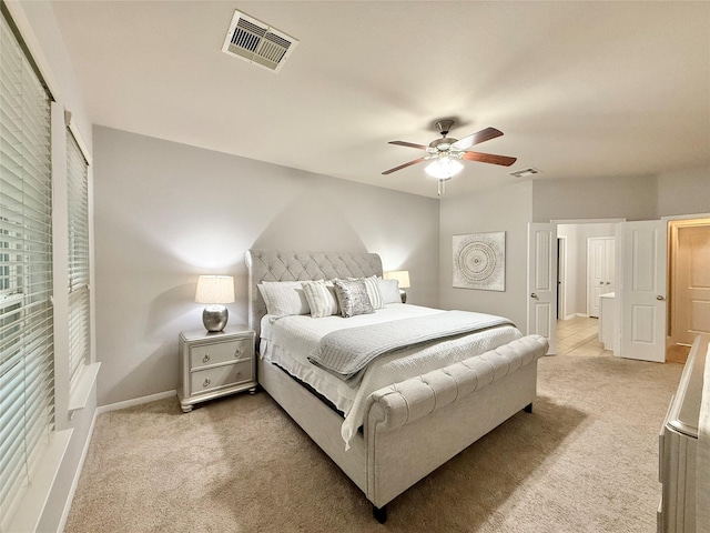 210 Black Swan Pl, The Woodlands, TX 77354 - bedroom featuring light colored carpet, ceiling fan, and baseboards