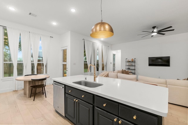17460 Chestnut Cove Dr, Conroe, TX 77302 - kitchen featuring a sink, open floor plan, dishwasher, an island with sink, and recessed lighting