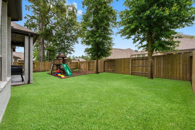 17460 Chestnut Cove Dr, Conroe, TX 77302 - view of yard featuring a playground