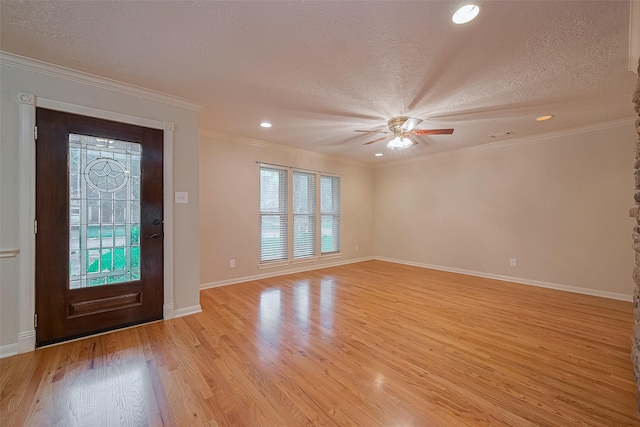 2718 Silver Falls Dr, Kingwood, TX 77339 - entryway with healthy amount of natural light, a textured ceiling, ceiling fan, light wood-style floors, and recessed lighting