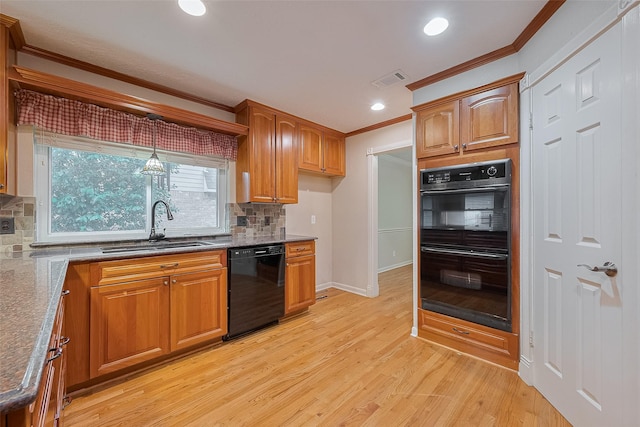 2718 Silver Falls Dr, Kingwood, TX 77339 - kitchen with black appliances, crown molding, backsplash, light wood-type flooring, and brown cabinetry