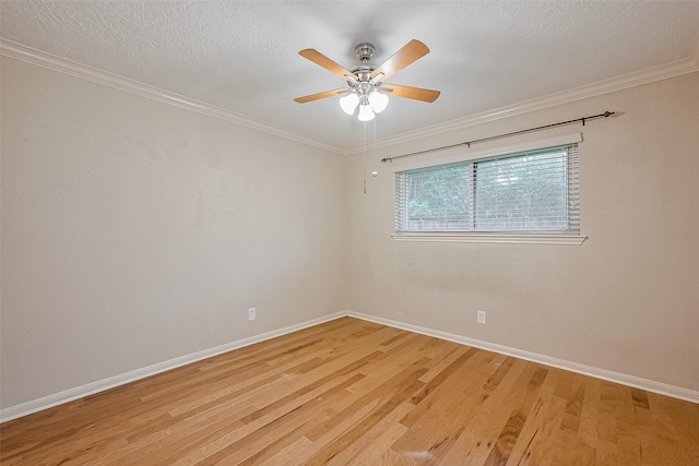 2718 Silver Falls Dr, Kingwood, TX 77339 - spare room featuring light wood-style floors, a ceiling fan, crown molding, and a textured ceiling