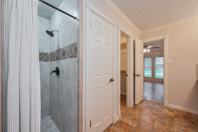 2718 Silver Falls Dr, Kingwood, TX 77339 - bathroom featuring tiled shower, ornamental molding, and a textured ceiling