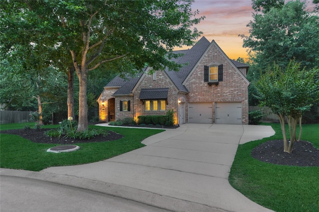130 Playmoor Pl, Montgomery, TX 77316 - view of front of house with concrete driveway, an attached garage, brick siding, and a shingled roof