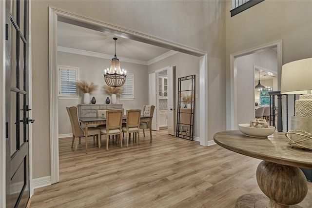 130 Playmoor Pl, Montgomery, TX 77316 - dining space featuring a chandelier, light wood-style floors, baseboards, plenty of natural light, and ornamental molding