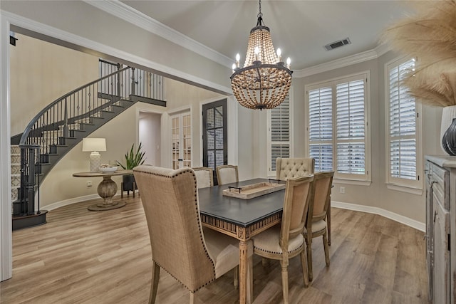 130 Playmoor Pl, Montgomery, TX 77316 - dining space with a chandelier, stairway, healthy amount of natural light, light wood-style flooring, and ornamental molding