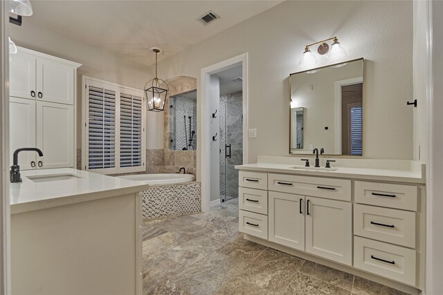 130 Playmoor Pl, Montgomery, TX 77316 - full bath with two vanities, a bath, and a stall shower