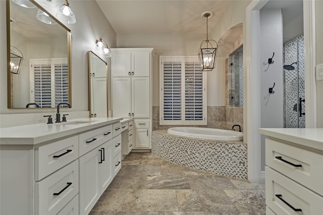 130 Playmoor Pl, Montgomery, TX 77316 - bathroom with vanity, a garden tub, stone finish floors, a chandelier, and a tile shower