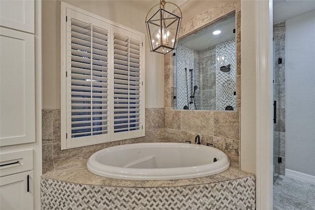 130 Playmoor Pl, Montgomery, TX 77316 - bathroom featuring a garden tub, tiled shower, and a chandelier