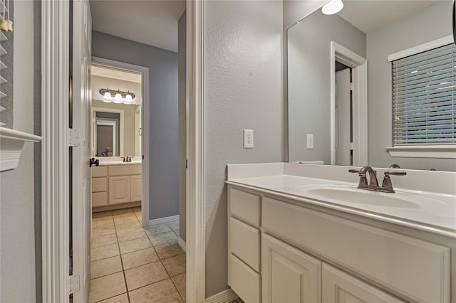 130 Playmoor Pl, Montgomery, TX 77316 - bathroom featuring vanity, tile patterned flooring, and baseboards
