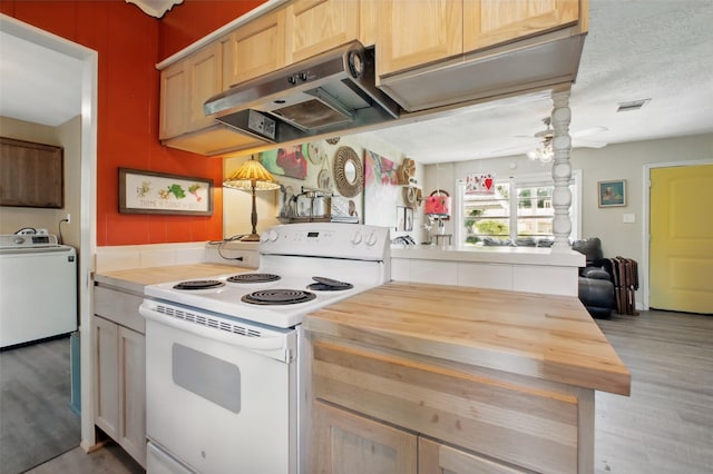 603 Briarwood Dr, Baytown, TX 77520 - kitchen featuring white electric stove, washer / clothes dryer, wood counters, light wood finished floors, and extractor fan