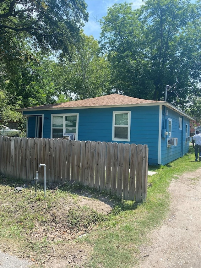 6706 Tippett St, Houston, TX 77091 - view of side of home featuring cooling unit