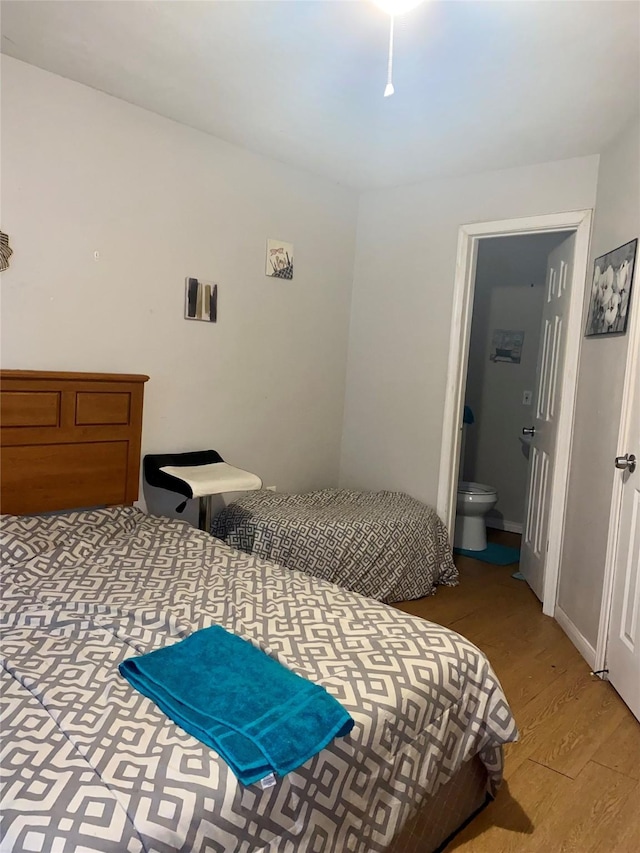 6706 Tippett St, Houston, TX 77091 - bedroom featuring light wood-type flooring and ensuite bath